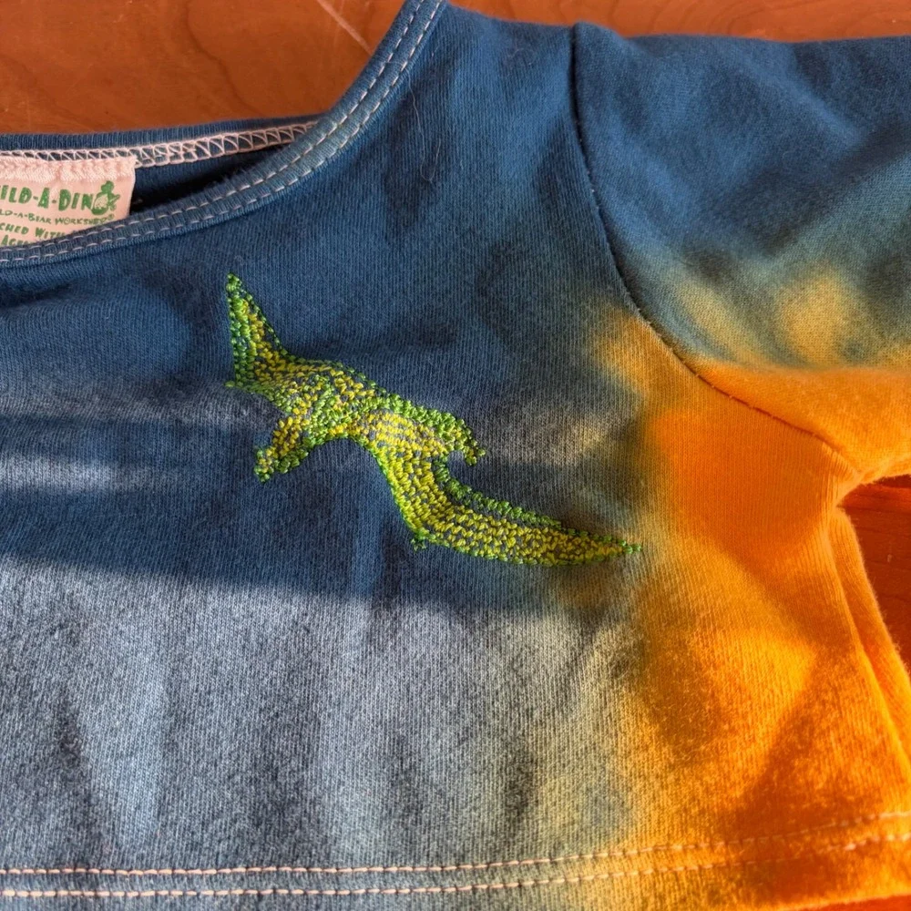 Build-A-Dino Build-A-Bear Tie Dye Dinosaur Embroidered Plush Shirt Blue Yellow